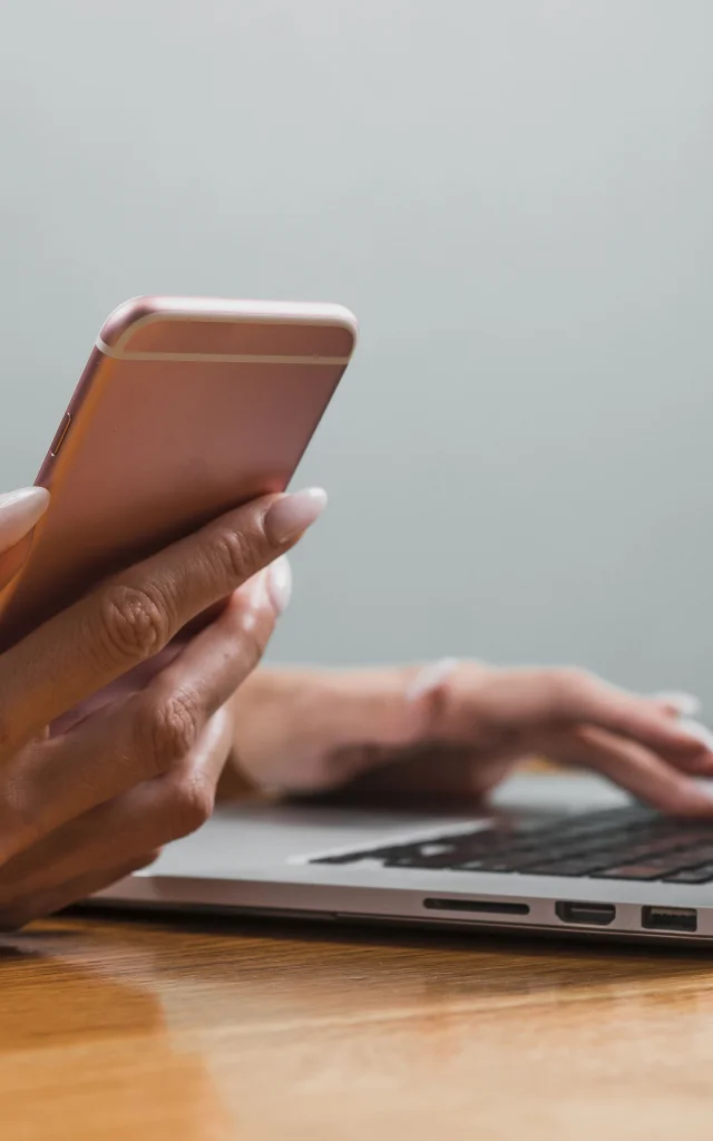 Woman Hands Using Phone Laptop Min