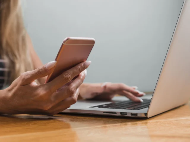 Woman Hands Using Phone Laptop Min